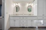 First floor master bathroom featuring double sinks